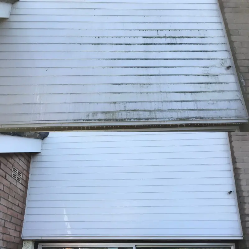 Before and after cladding cleaning on an industrial building